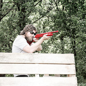 man training with red replica shotgun
